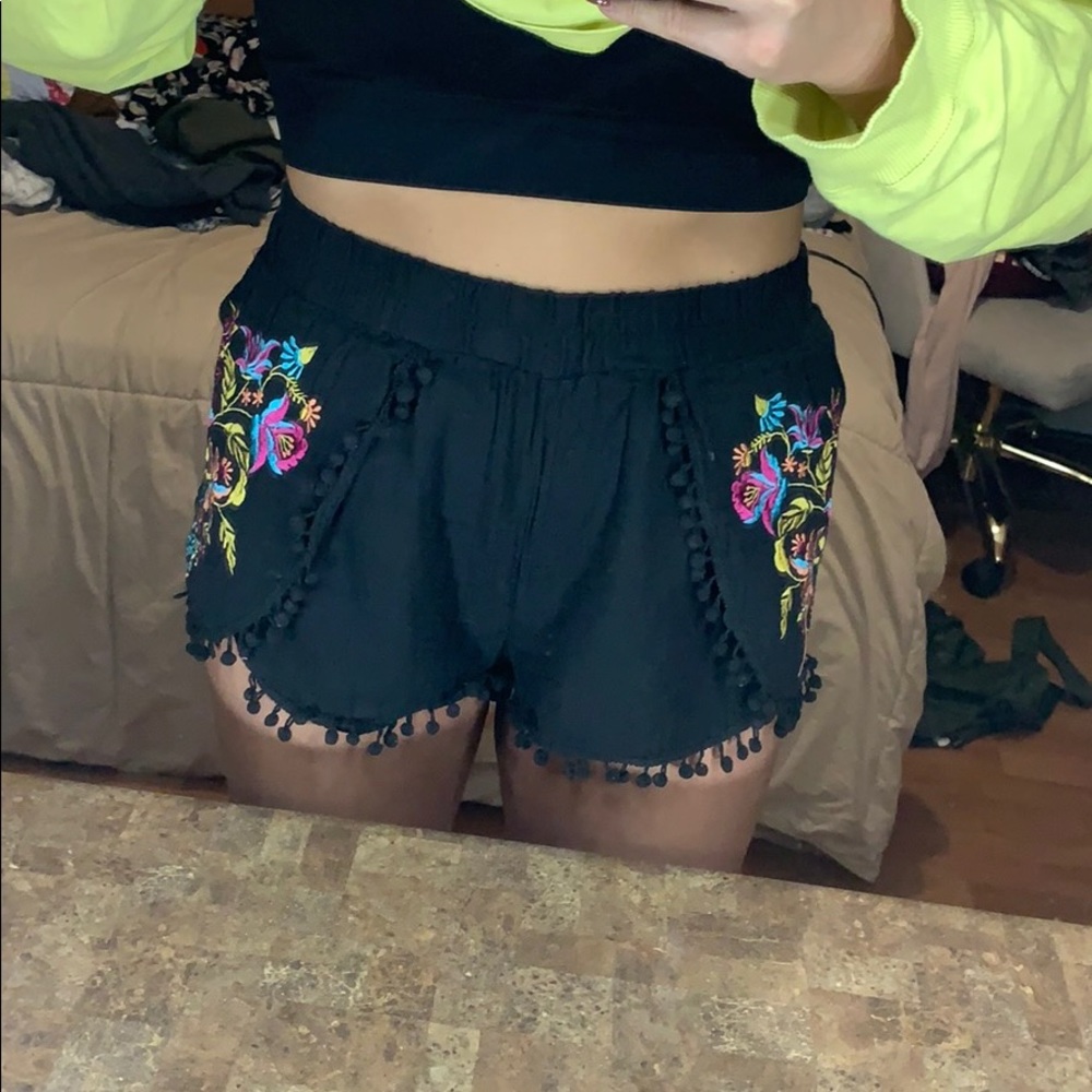 Black shorts with a pretty pattern.